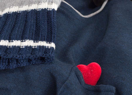 blue sweater with a heart tucked with the sleeveの写真素材