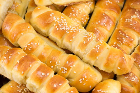 bunch of sesame pastry in a black pan