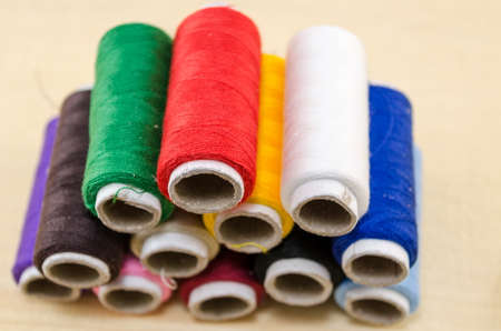 Sewing thread in various colors on a pile