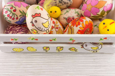 Decoupage decorated Easter eggs in decorated white wooden box