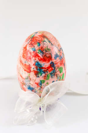Hand painted colorful Easter egg on white backgroundの写真素材