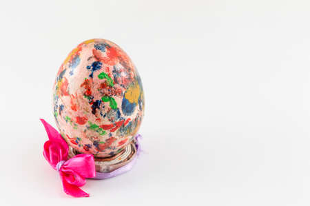 Painted Easter egg in custom made egg holderの写真素材