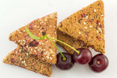 Bunch of integral fruit biscuits with fresh cherriesの写真素材