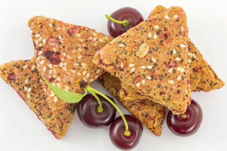 Bunch of integral fruit biscuits with fresh cherriesの写真素材