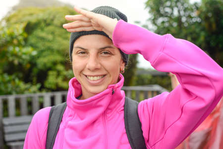 portrait of a female mountaineer wearing pink
