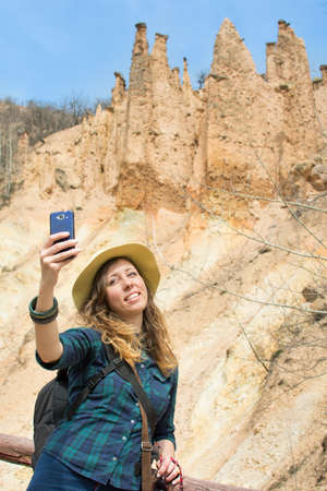 Woman hiker with backpack on a hiking trip