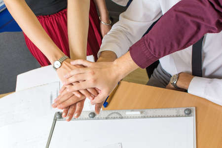 Teamwork for a success. Team support at the officeの写真素材