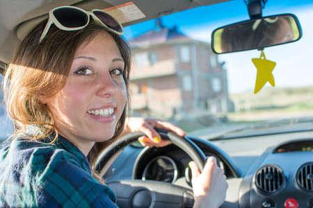 Young woman driving a car
