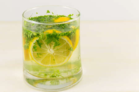 Water with parsley and lemon. Diet beverageの写真素材