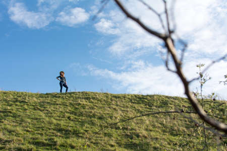 Happy hiker alone on the hillの写真素材