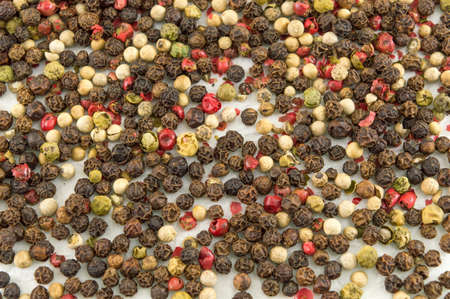 red and brown pepper balls on the white table