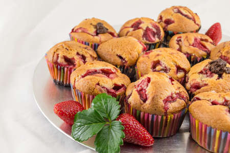 Strawberry muffins on a plate with fresh strawberry fruitの写真素材