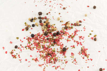red and brown pepper balls on the white table