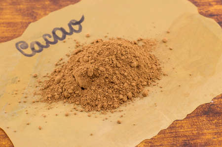 Cacao powder on a labeled dark cooking paper