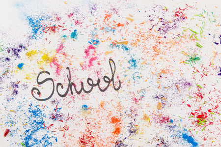 Word School written on white paper covered in colored pencils sharpening leftoversの写真素材