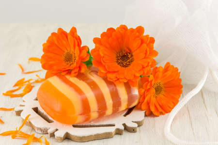 marigold soap with a fresh flower bouquet. Natural cosmetics productの写真素材