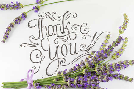 Thank you card with lavender flowers on tableの写真素材