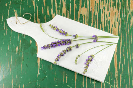 Lavender flower branches on a wooden trayの写真素材