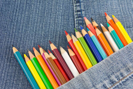 Colorful pencils in denim blue jeans pocket