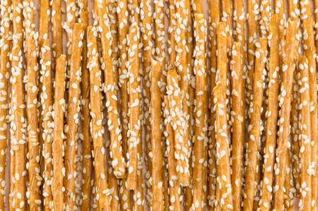 Bunch of salty breadsticks snack background patternの写真素材