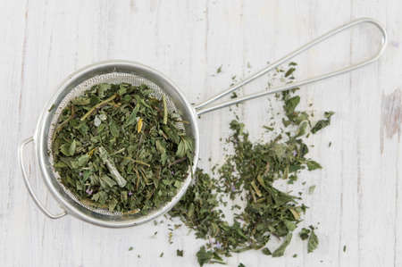 Mint tea natural herbs on a wooden table
