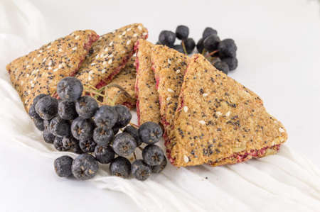 Sweet integral cookies with aronia fruit on a table