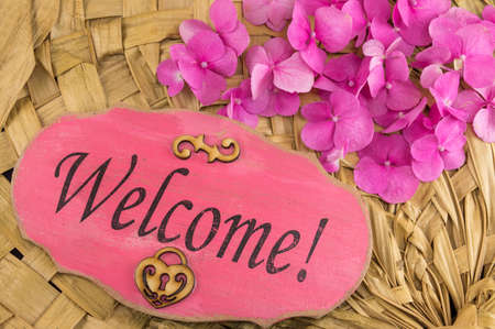 Welcome note written on the wooden frameの写真素材