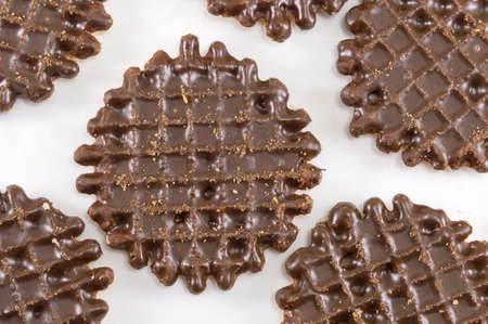 Chocolate covered round homemade cookies on white