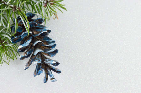 Pinecones and fir tree on sparkling background. Christmas decoration backgroundの写真素材