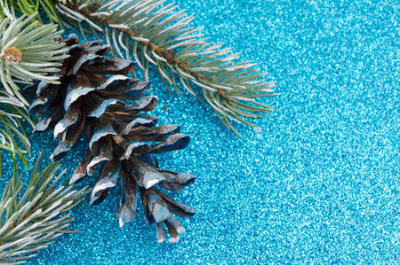 Pinecones and fir tree on sparkling background. Christmas decoration backgroundの写真素材