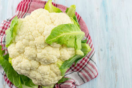 Raw cauliflower on a wooden table. Healthy eatingの写真素材