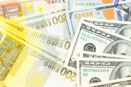Bunch of dollar and euro bills backgroundの写真素材