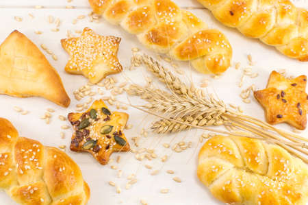 Homemade shaped bread and pastry with wheat plantの写真素材