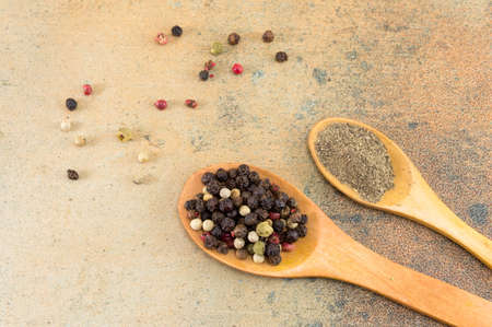 red and brown pepper balls and powder on stone tableの写真素材