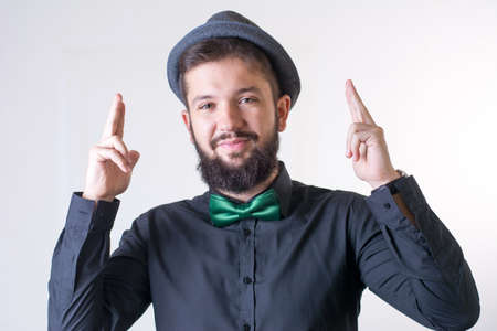 Fashionable man in a black shirt with a bow tie