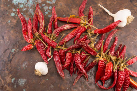 Garlic and red pepper on stone background