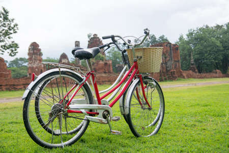 Bicycle tour among the ruins of ancient Ayutthaya Kingdom in Thailand