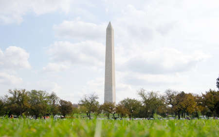 WASHINGTON DC, USA - OCTOBER 20, 2016 Washington monument rising from the grass on a cloudy dayのeditorial素材
