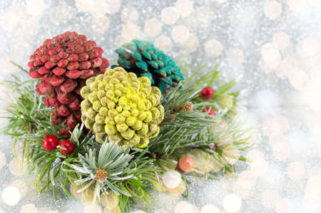 Pinecones and fir tree on sparkling background. Christmas decoration backgroundの写真素材