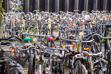 Amsterdam, the Netherlands - 18.09.2015: Big bicycle parking in the city center, crowded as usual at day timeのeditorial素材