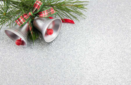 Two Christmas bells decoration with festive backgroundの写真素材