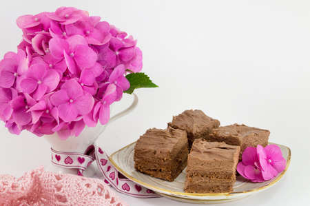 bunch of hortensia pink flowers and homemade cakeの写真素材