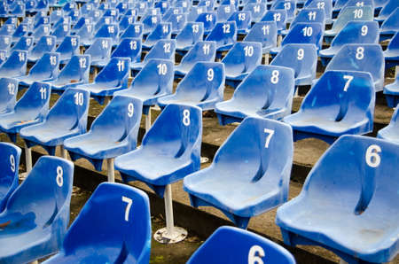 Empty auditorium with blue numbered plastic chairsの写真素材