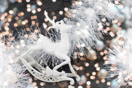 Silver reindeer toy on dark festive backgroundの写真素材