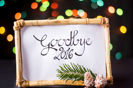 handwirtten goodbye 2016 with star colorful bokeh