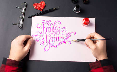 Point of view of a Man writing a Thank you noteの写真素材