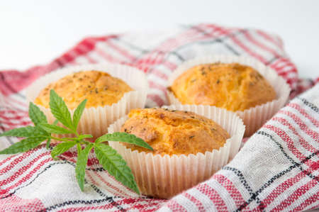 Marijuana cupcake muffins and leaves on a plateの写真素材