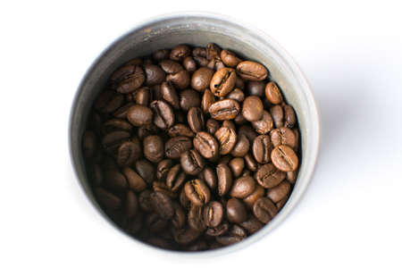 Roasted coffee beans in a metal can