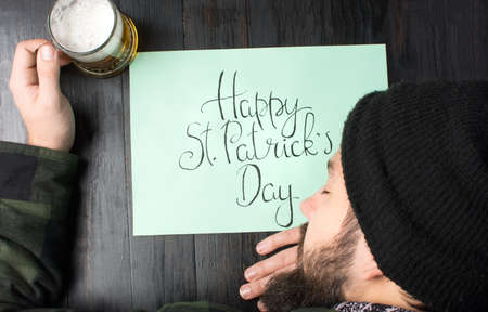 Man sleeping on a table during St Patricks day celebration