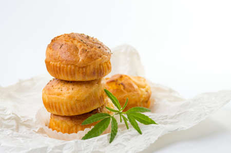 Cannabis cupcake muffins and leaves on a cooking paperの写真素材